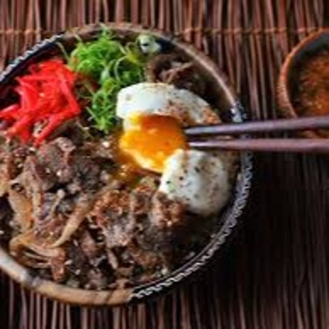 Jamaican Rice Bowl - Sweet Chili Steak Tips, Fried egg, Avocado, Cucumber.