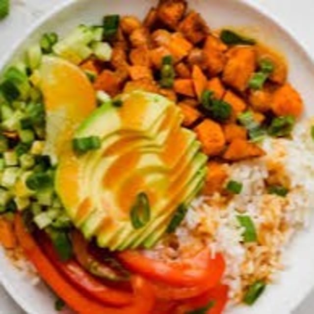 Vegan Rice Bowl - Carrots, cucumber, avocado, sautéed mixed veggies.